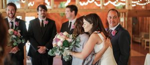 bride hugging her mom at her wedding in alta
